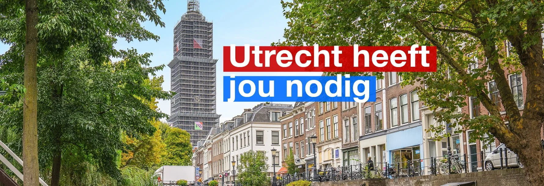 Foto vanaf de Oudegracht met zicht op de domtoren en de tekst 'Utrecht heeft jou nodig'