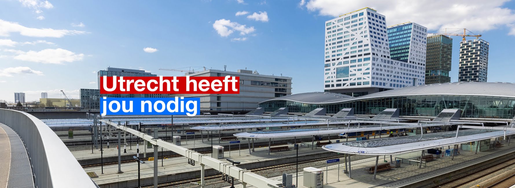 Uitzicht over Utrecht centraal, met op de achtergrond het stadskantoor. In beeld staat de tekst Utrecht heeft jou nodig.